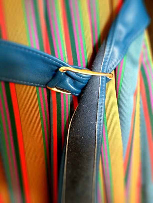 leather belt buckle on silk dress